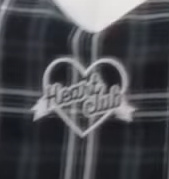 A heart decoration with text reading 'Heart club.'